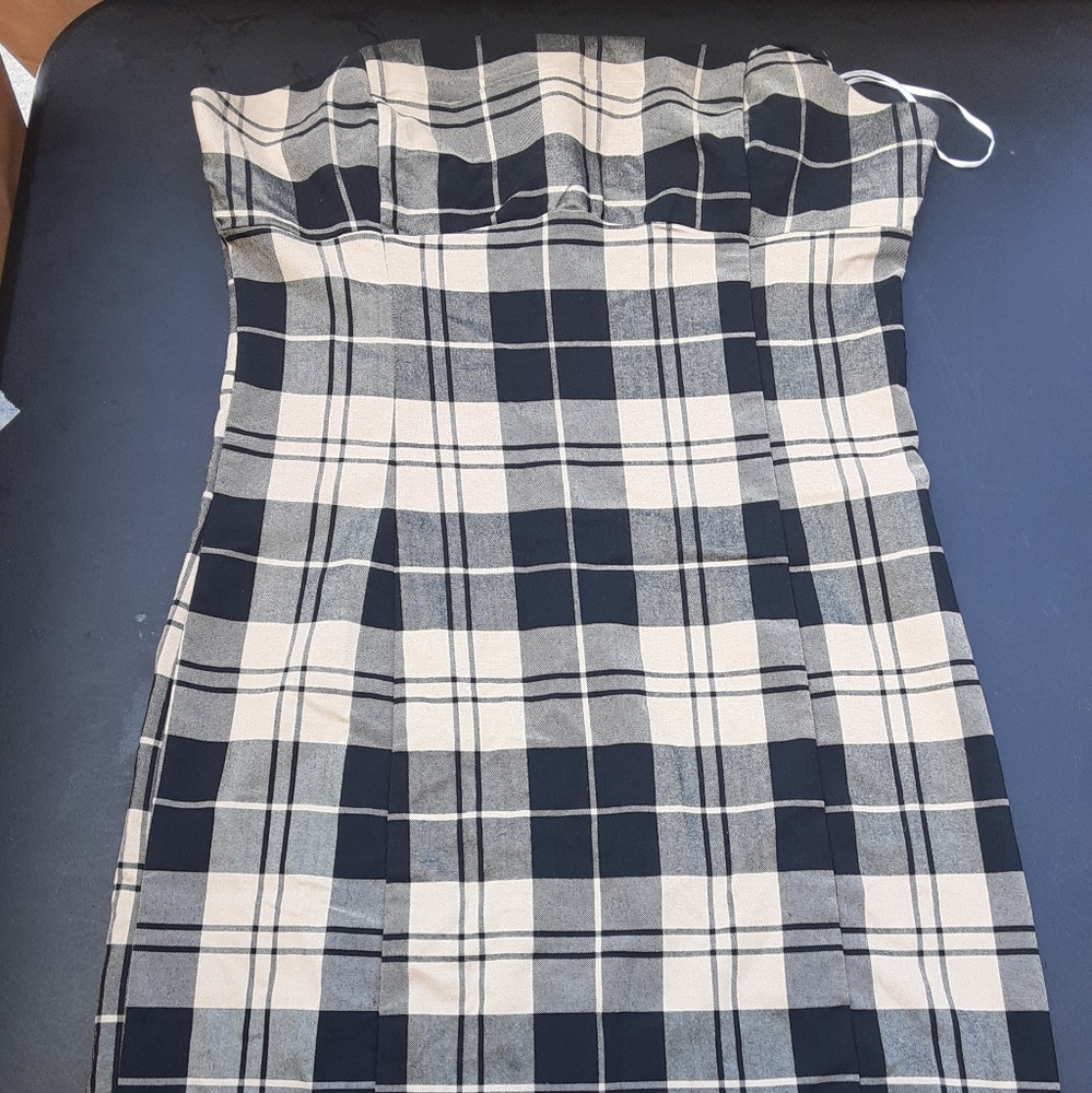 I'm selling a love tree dress it's a medium size and its black and brown